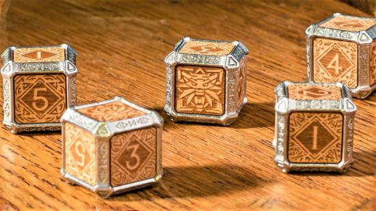 Kickstarter photo of Q workshop metal and wood Witcher hybrid dice