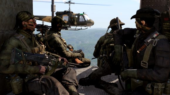 screenshot from Arma 3 Creator DLC S.O.G. Prairie Fire showing the view from inside a US helicopter, carrying a special operations team to a mission