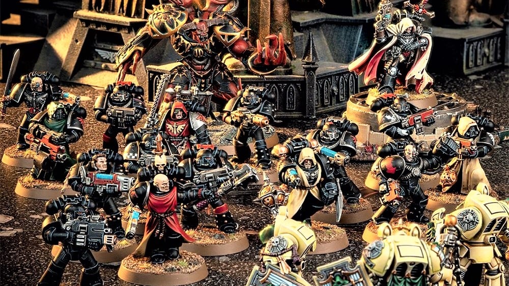 Warhammer 40k Dark Angels - Warhammer Community photo showing models of a warband of fallen dark angels fighting loyal Deathwing Knights