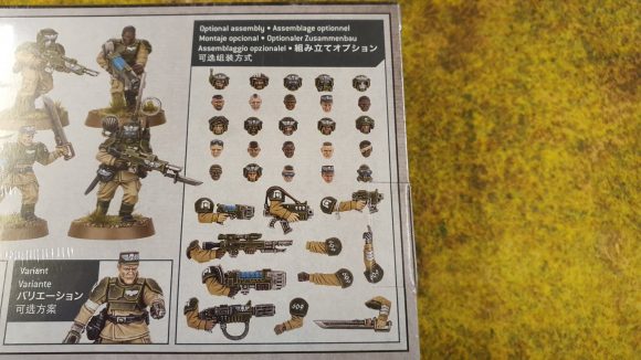 Photo of the box rear side of the new Warhammer 40K Cadian Shock Troops kit, zoioming in on the new heads and weapons