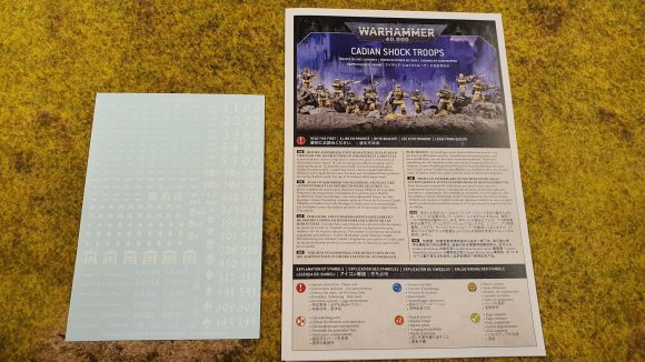 Photo of the instructions and transfer sheet included in the new Warhammer 40K Cadian Shock Troops kit