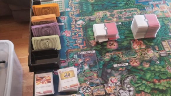 Pokemon board game cards and paper money