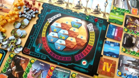 Terraforming Mars: Ares Expedition central board surrounded by cards, tokens, and cubes
