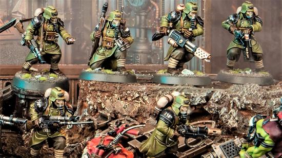 Warhamer 40k Kill Team 2nd edition warhammer community photo showing Krieg Veterans in green charging into Orks