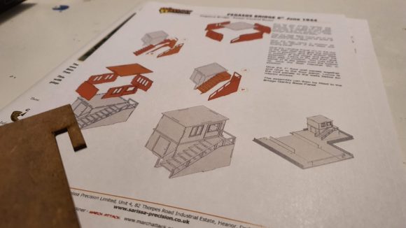 Bolt Action Pegasus Bridge review - photo showing the instruction sheets for the laser cut wood scenery
