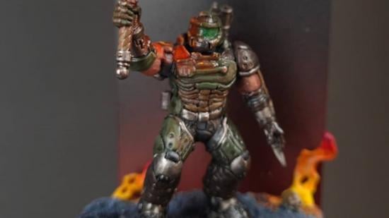 Warhammer 40k Space Marine Doom Slayer converted miniature holding a sword surrounded by flames