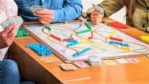 Best board game deals - photo of a family playing the Ticket to Ride board game