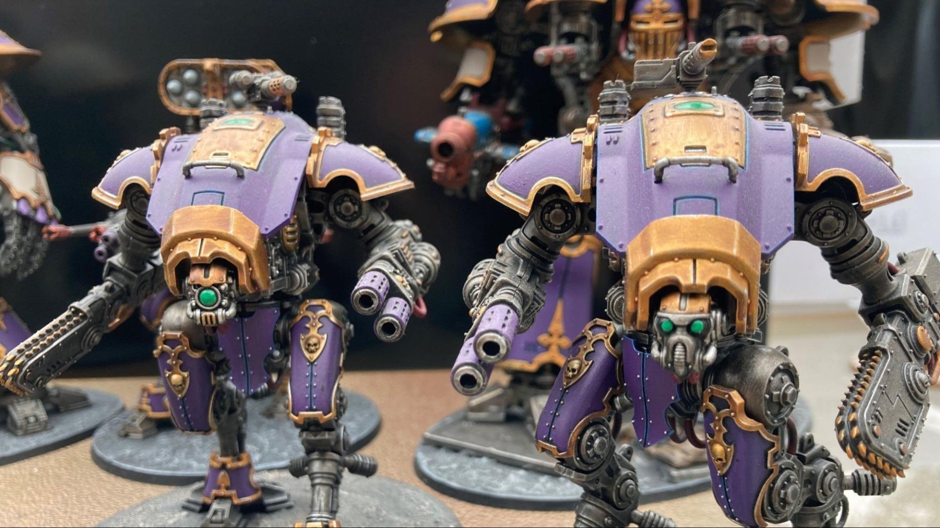 Warhammer 40k Imperial Knights army guide - Photo provided to the author by Alan Bailey showing two Imperial Knight armigers in a purple and gold paint scheme