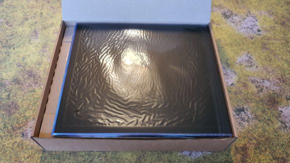 Mantic Games OverDrive review - Author's photo showing the open cardboard box and wrapped game board