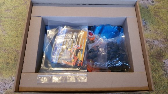 Mantic Games OverDrive review - Author's photo showing the game minis, cards, and materials in the open box