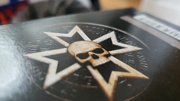 Warhammer 40k Black Templars Army Set review - author photo close up of the templar cross insignia on the edge of the box