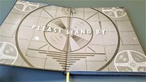 Fallout The tabletop RPG core book - Author photo showing the inside front cover artwork, depicting the 'Please Stand By' screen
