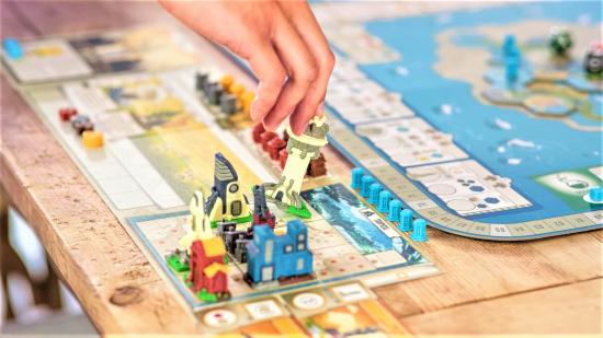 Best black friday board game deals guide - sales photo showing the board and building pieces from the Tapestry board game