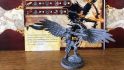 Pathfinder board game kickstarter launch - Giochi Uniti photo showing a plastic miniature of a winged archer, with its skills listed on a character card behind