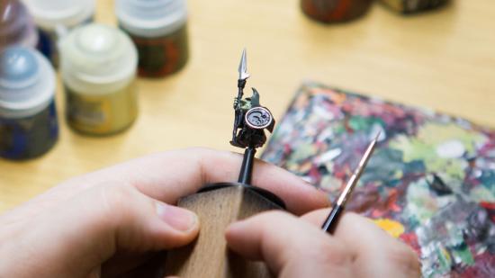 Warhammer: The Old World miniatures a night goblin being painted