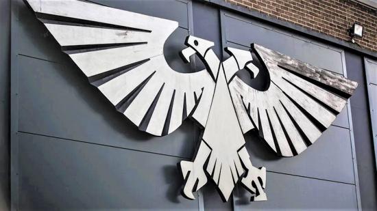 Games Workshop stops Warhammer sales in Russia over Ukraine - Warhammer Community photo of the metal Aquila sign on the wall of Warhammer World in Nottingham, UK