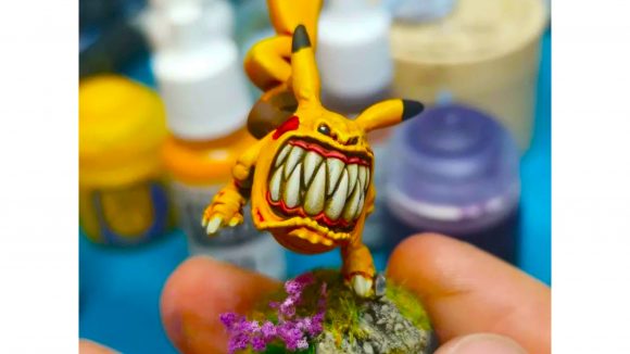 Warhammer 40k squig Pokemon - custom squig mini desigend to look like Pikachu, a yellow pokemon with red cheeks and pointy ears