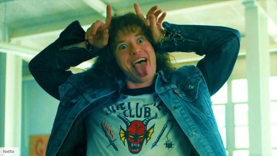 DnD Stranger Things Eddie Munson - Eddie Munson sticks his tongue out and forms mock devil horns above his head with his hands
