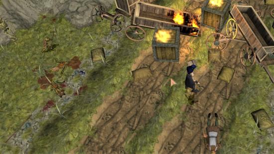 Baldur's Gate Dark Alliance 2 - a necromancer beside some burning wagons.