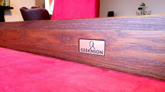 Best gaming tables guide - GeekNSon Megan - author's photo of the GeekNson logo plaque on the interior of the table