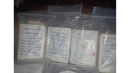 MTG decks made in prison - basic paper versions of MTG cards in plastic baggies close-up.