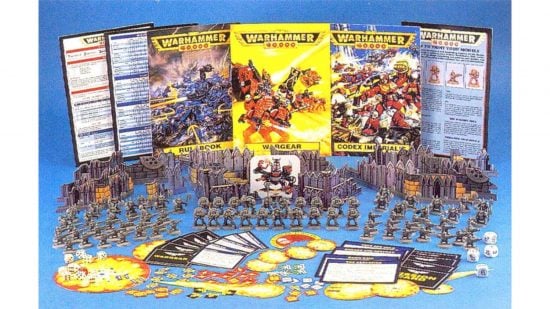 Warhammer 40k 2nd edition starter set, brightly colored rulebooks, cardboard terrain, many tokens and cards, and a large number of unpainted miniature Orks and Space Marines