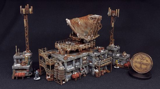 Full Spectrum Dominance is like Warhammer 40k meets Total Annihilation - photo of models by the Lazy Forger, tiny model representing a large radar station, shown with a coin for scale