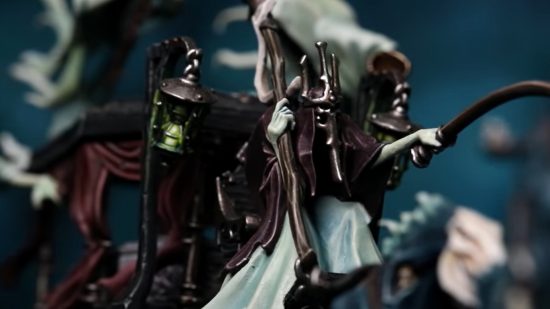 Nighthaunt army guide - photo by Games Workshop of a shrouded ghost riding in the driver's seat of a coach