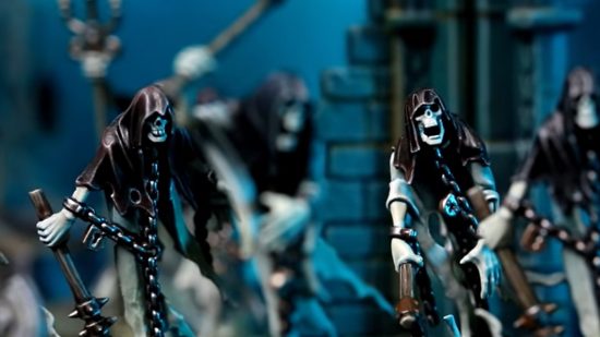 Nighthaunt army guide - photo by Games Workshop of chainrasp models, hooded ghosts with skeletal faces dragging rusted weapons