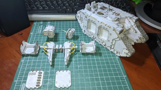 Warhammer 40k Land Raider papercraft model by Denys Tsokhla , showing guns and door hatches detached from the model