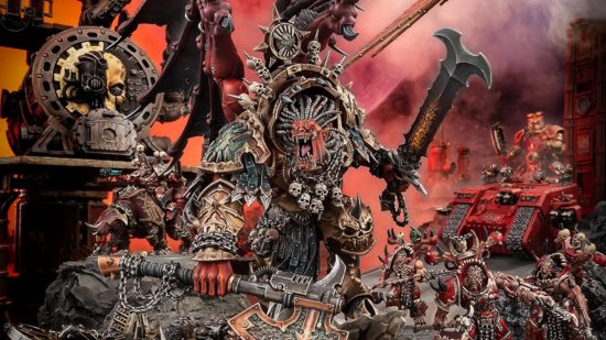 Warhammer 40k factions world eaters - model photograph by Games Workshop of Angron, a huge, roaring red daemon with massive melee weapons, great wings, and brazen armour