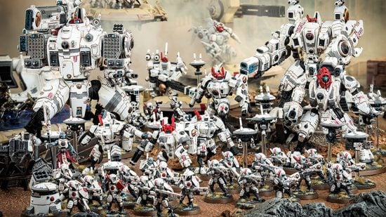 Warhammer 40k Tau Empire army guide - Games Workshop image showing a large Tau tabletop army painted in the white Vior'la Sept colour scheme