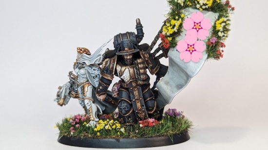 Warhammer 40k wedding cake topper - an inquisitor bride and death guard groom on a flower-covered base front view