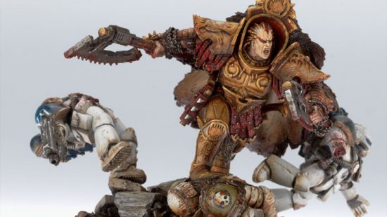 Warhammer 40k World Eaters - model by Games Workshop, Angron, a giant warrior in golden armour, slaying lesser warriors with a pair of huge, chainsaw axes