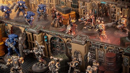 Warhammer 40k Adeptus Arbites models - model diorama by Games Workshop, a Space Marine chaplain leads a boarding assault against Chaos space marines