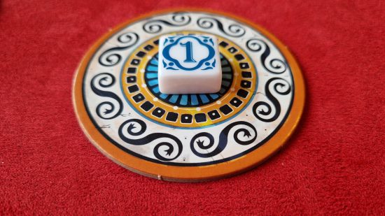 Azul board game review - author photo showing the first player tile on a supply dish