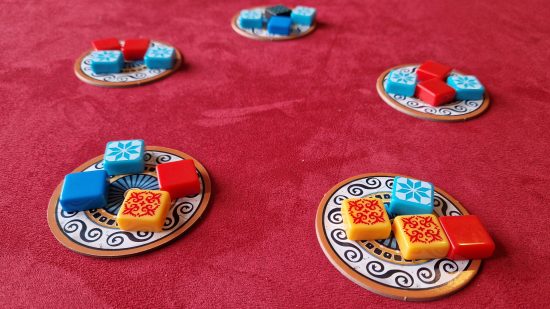 Azul board game review - author photo showing five supply dishes with tiles laid out on them ready for drafting