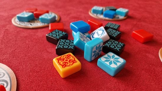 Azul board game review - author photo showing a pile of tiles, including the first player tile