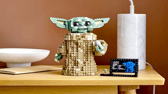 Best Star Wars LEGO sets guide - LEGO sales image showing the The Child Baby Yoda model, fully built, on a tabletop with its name plaque