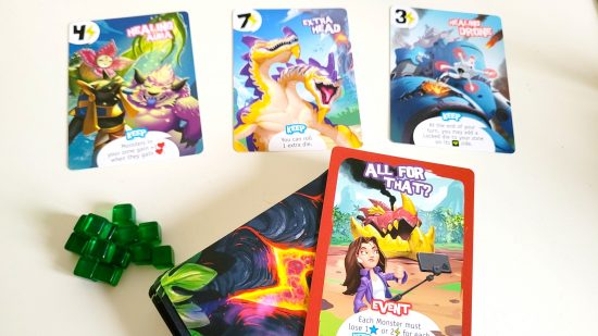 King of Monster Island board game review - author photo showing the game's cards and token cubes
