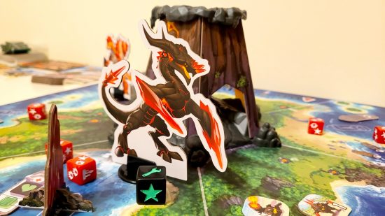 King of Monster Island board game review - author photo showing the game board, volcano dice tower, and crystal dragon boss