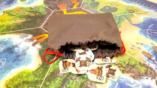 King of Monster Island board game review - author photo showing the bag of random minion tokens