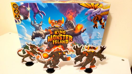 King of Monster Island board game review - author photo showing the box front art and standees for the three bosses