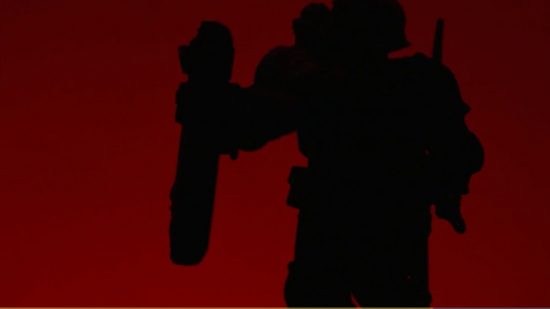 Warhammer 40k Adeptus Arbites model - a preview image by Games Workshop, showing the silhouette of a miniature, wielding a riot shield and wearing a basing helmet