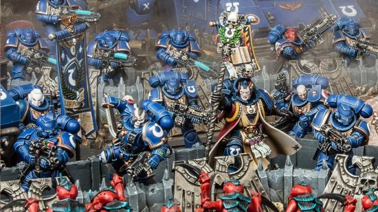 Warhammer 40k Arks of Omen balance dataslate - photo by Games Workshop of blue armoured Ultramarines Space Marines defending a position from Tyranids