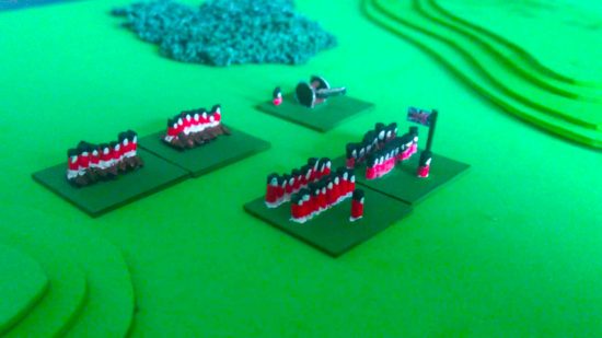 Warhammer 40k cheapest possible alternative - an army of tiny Napoleonic soldiers made from rice march across a green foam battelfield