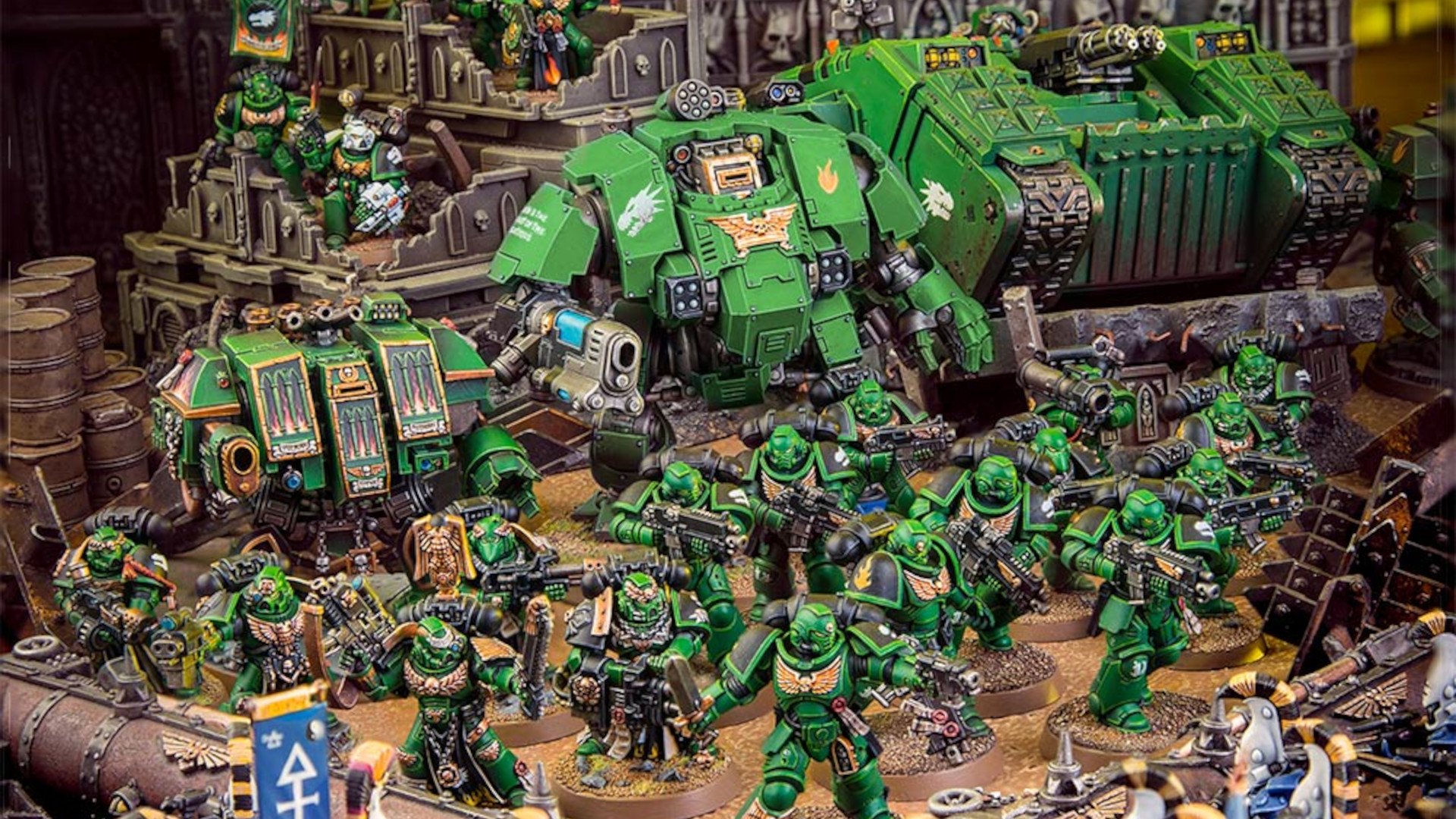 Warhammer 40k Salamanders army - diorama photograph by Games Workshop, a massed force of green armoured Salamanders Space Marines, dreadnought walkers and tanks