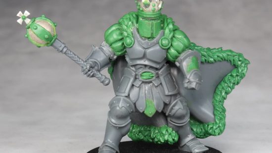 Warhammer Age of Sigmar Shovel Knight mini conversions - creator photo showing a work in progress stage of the king knight mini, with grey plastic and green stuff