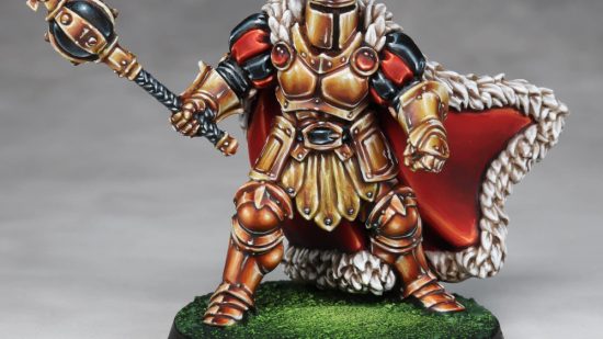 Warhammer Age of Sigmar Shovel Knight conversions - Juan Hidalgo's converted King Knight, painted vibrant gold and with a fur-trimmed red cape, made from Stormcast Eternals parts, from the front