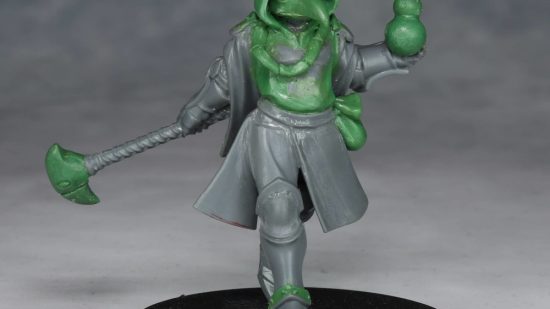 Warhammer Age of Sigmar Shovel Knight mini conversions - creator photo showing a work in progress stage of the plague knight mini, with grey plastic and green stuff
